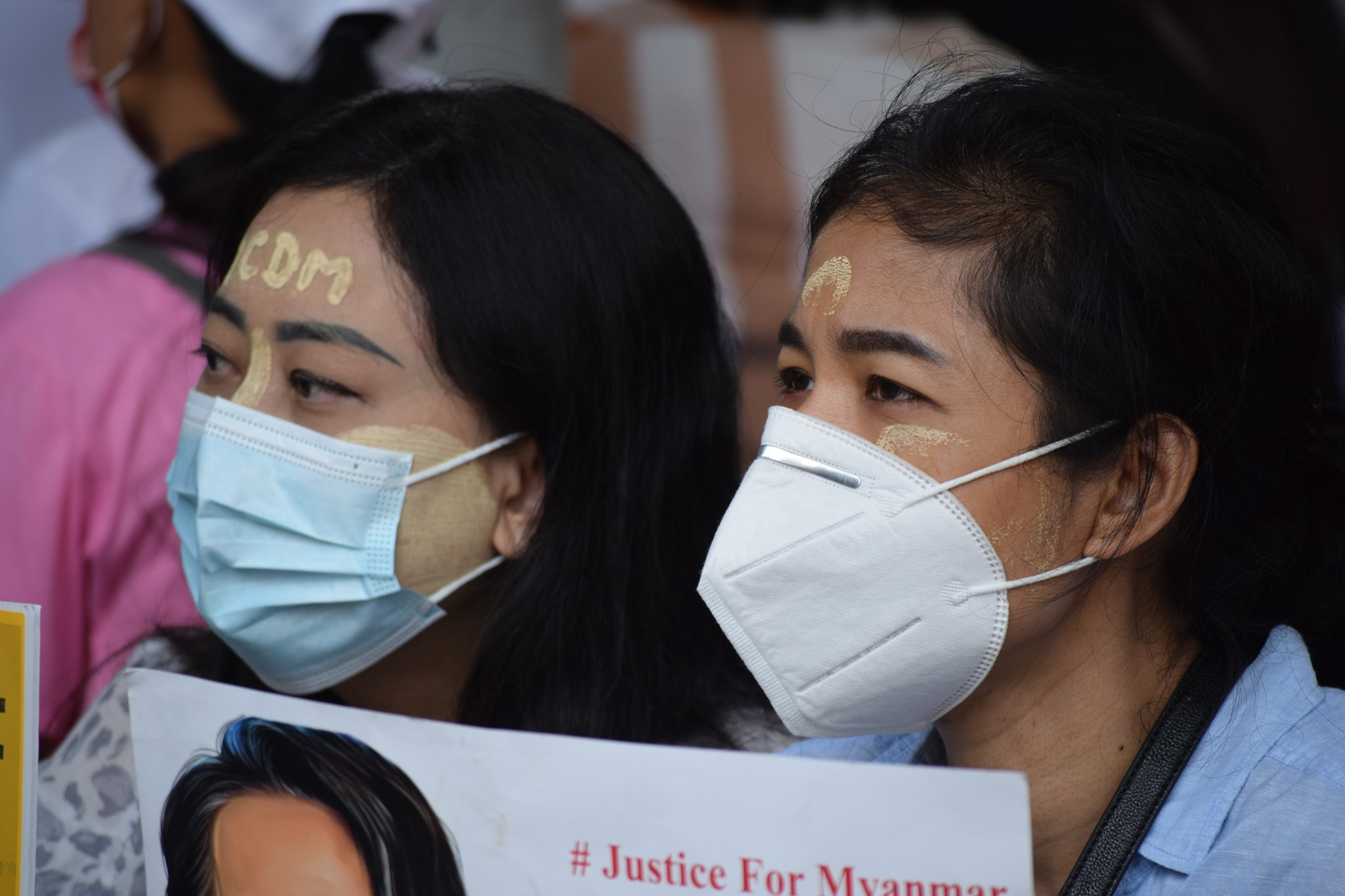 Protesters holding Justice for Myanmar signs